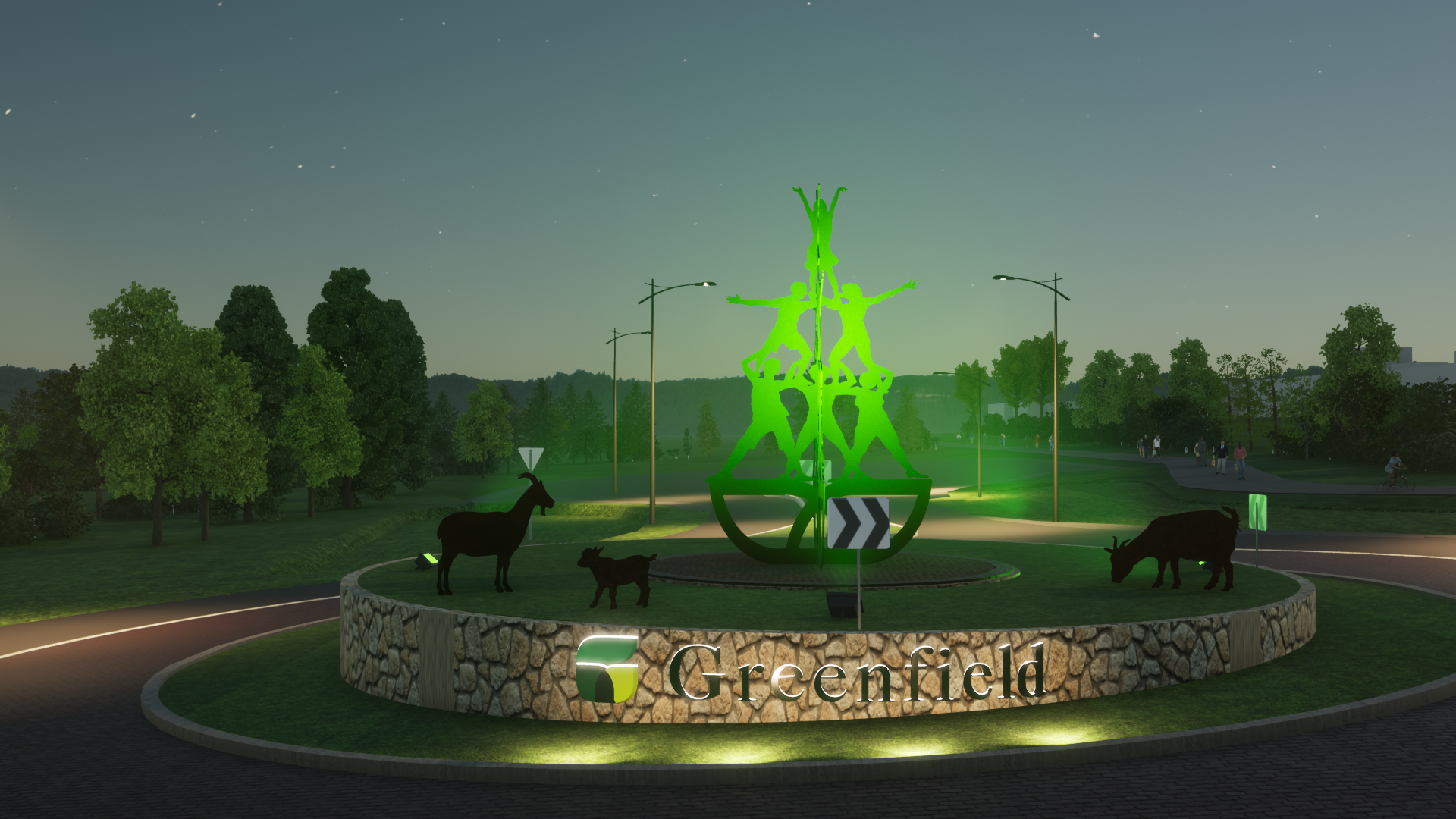 Roundabout art sculpture at night with green up lighting. 